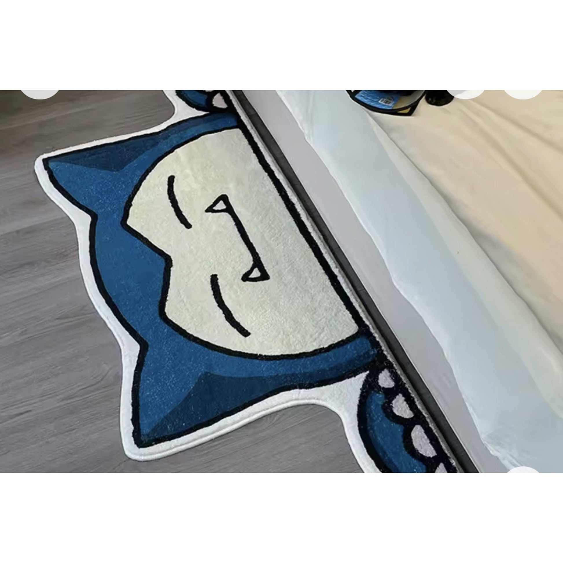 Sleepy anime accent rug — bedroom side view, soft cartoon room decor